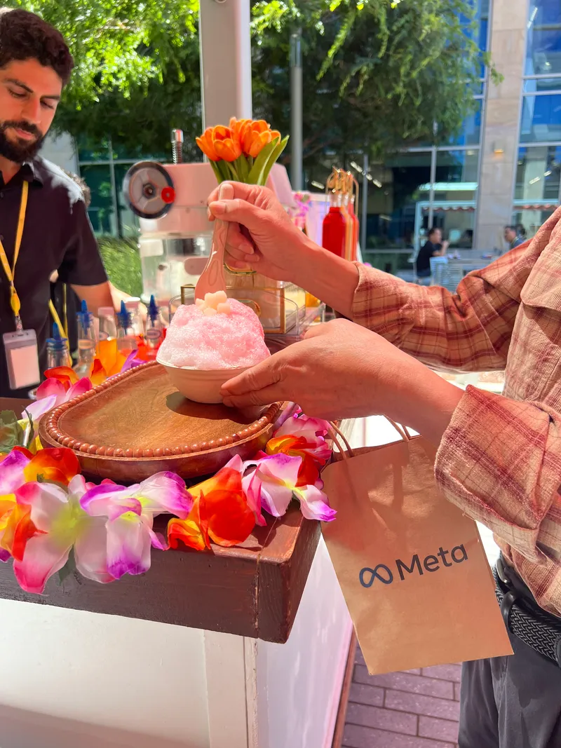 Meta employee grabbing Tropics Shave Ice at a corporate event